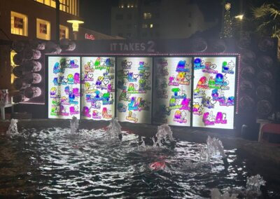fountain and digital mural in the background