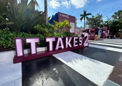 It Takes 2 pink sign