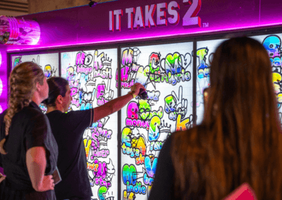 people painting the interactive wall