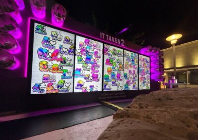 illuminated digital mural with vibrant colored tags